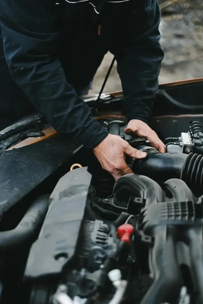 Professional mechanic performing doorstep car repair in Hyderabad